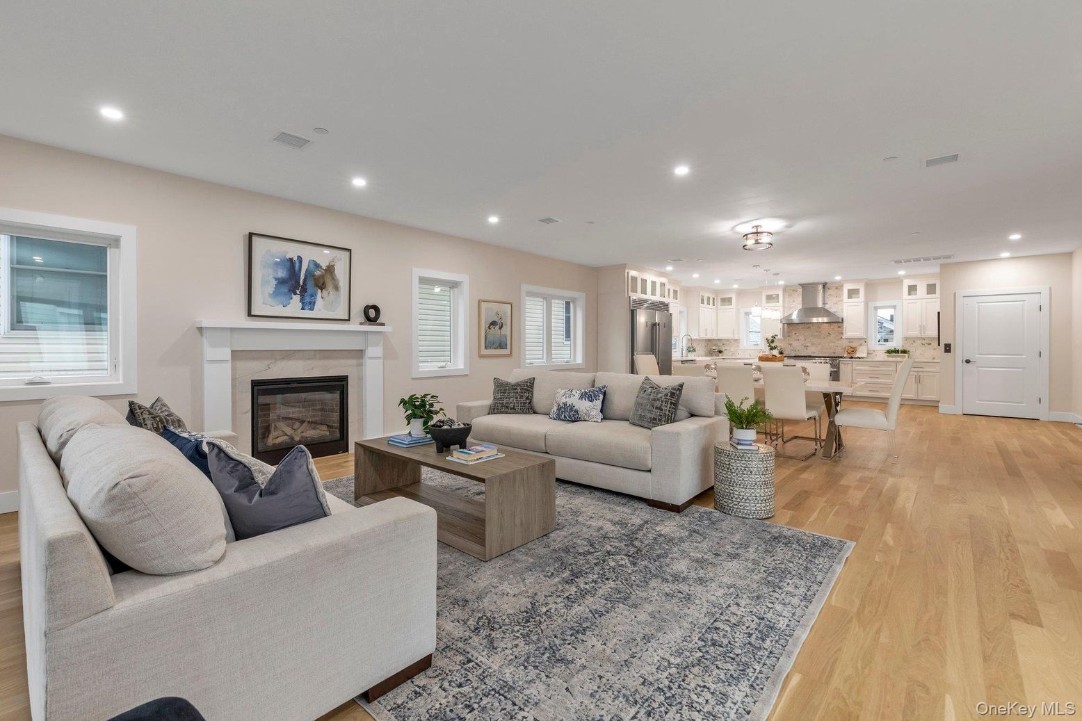 Dining room, Fireplace, Interior, Kitchen, Living room, Pendant Lights, Recessed Lighting, Stainless Steel Appliances, Wood Texture Flooring