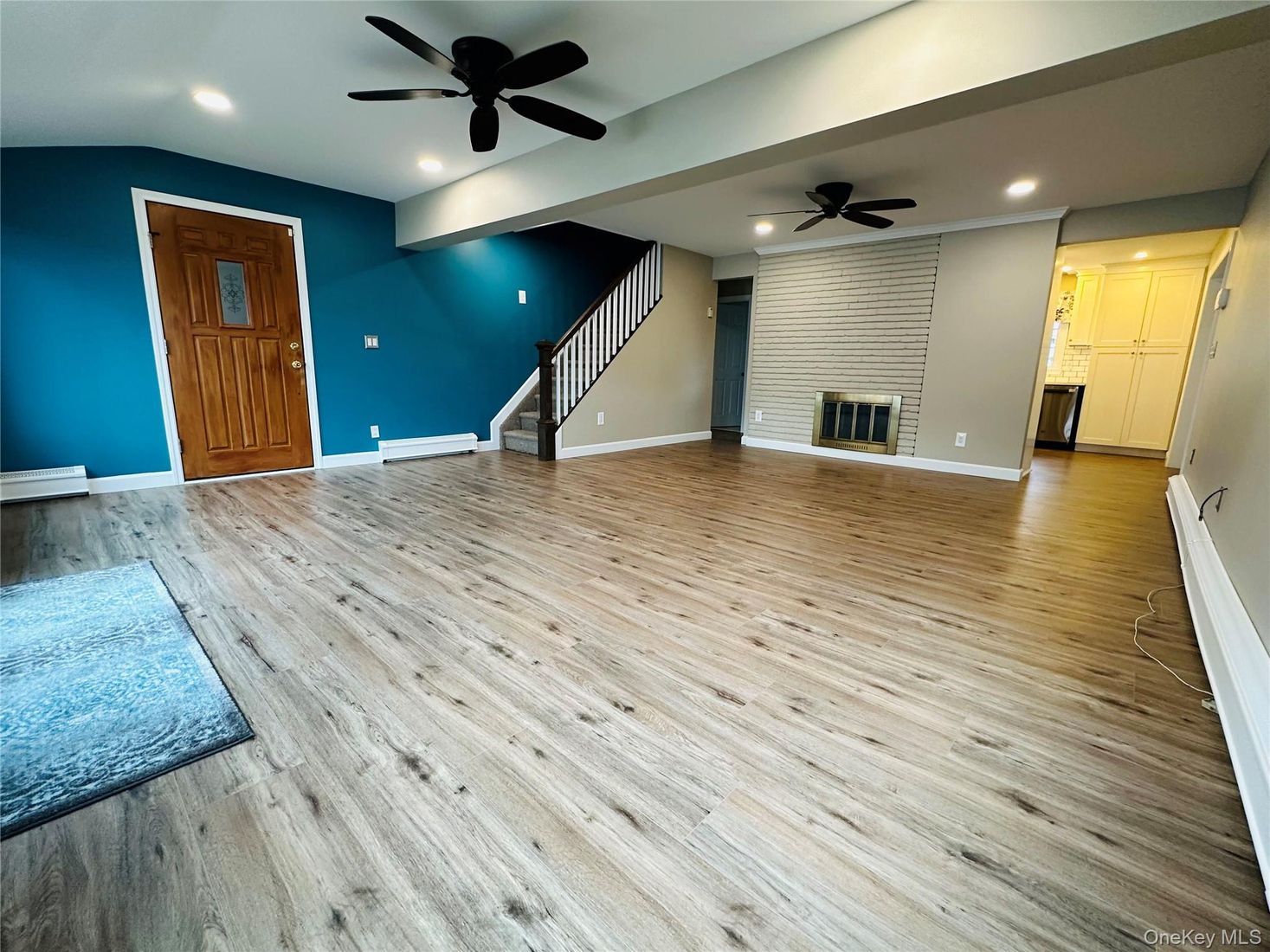 Empty room, Fireplace, Interior, Recessed Lighting, Stone Walls, Wood Texture Flooring