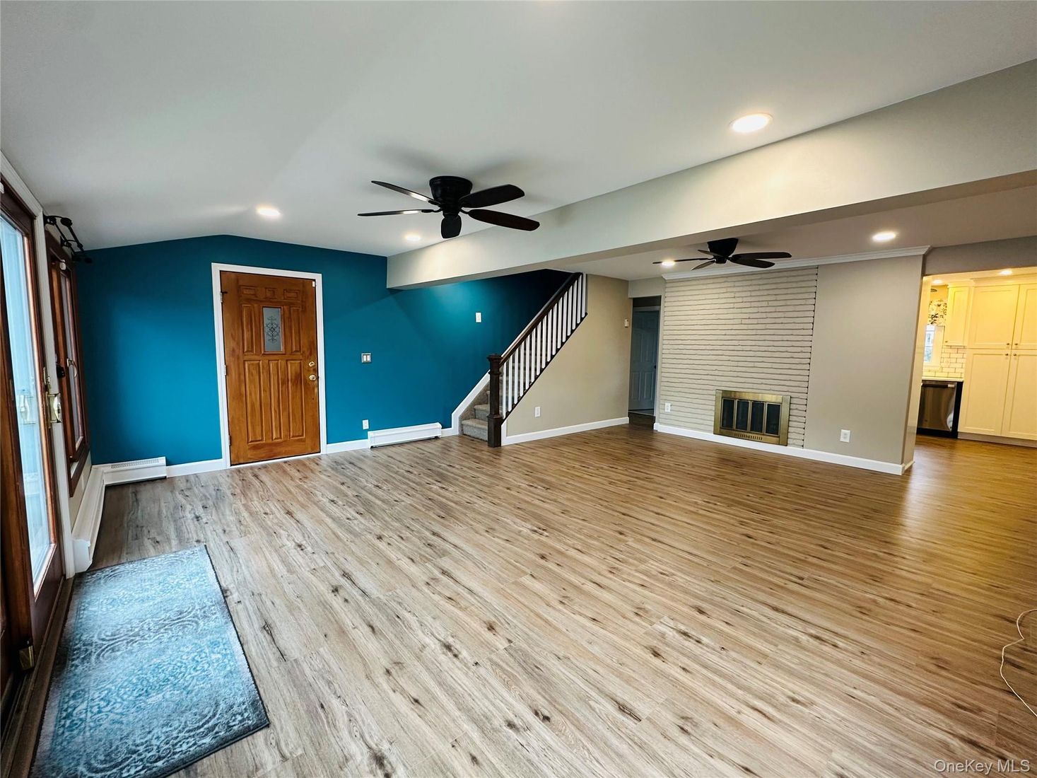 Empty room, Fireplace, Interior, Recessed Lighting, Stone Walls, Wood Texture Flooring