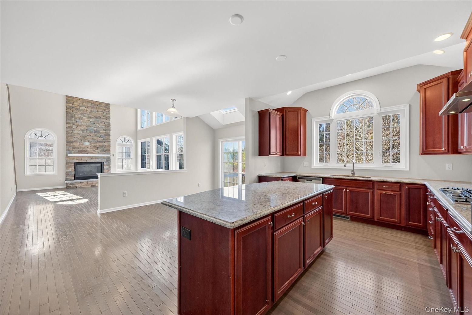Fireplace, Interior, Kitchen, Recessed Lighting, Stone Walls, Wood Texture Flooring