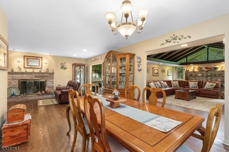 Chandelier, Dining room, Fireplace, Interior, Living room, Recessed Lighting, Wood Texture Flooring