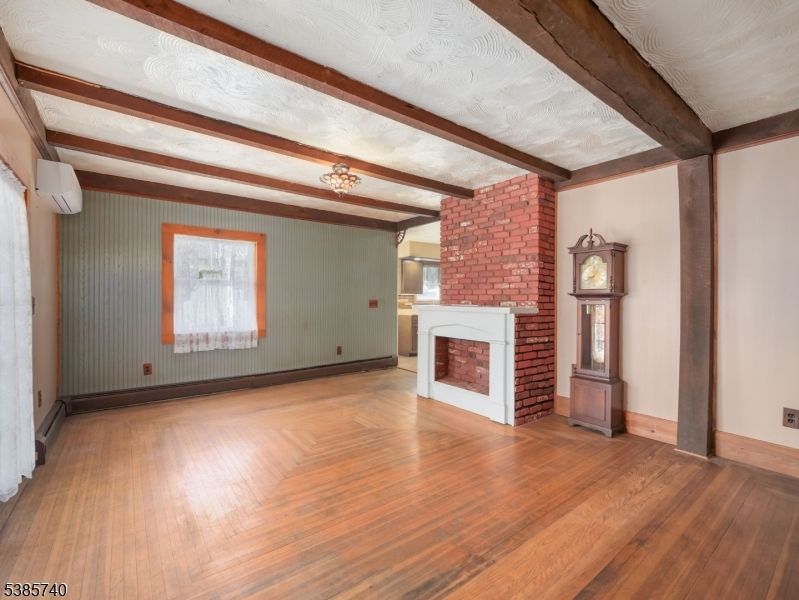 Empty room, Fireplace, Interior, Stone Walls, Wooden Beams, Wood Texture Flooring