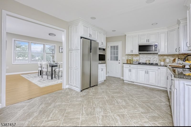 Dining room, Interior, Kitchen, Recessed Lighting, Stainless Steel Appliances, Wood Texture Flooring