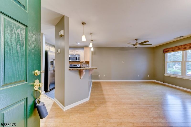 Empty room, Interior, Kitchen, Pendant Lights, Stainless Steel Appliances, Wood Texture Flooring