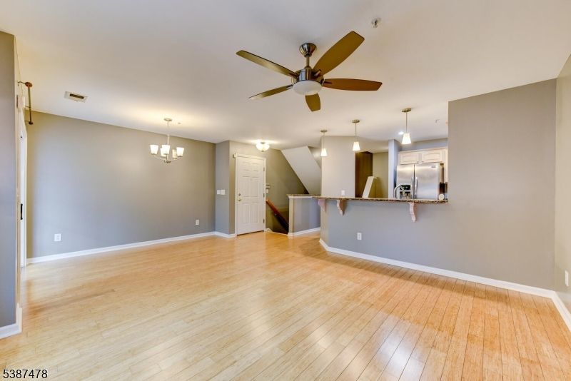 Chandelier, Empty room, Interior, Kitchen, Pendant Lights, Stainless Steel Appliances, Wood Texture Flooring