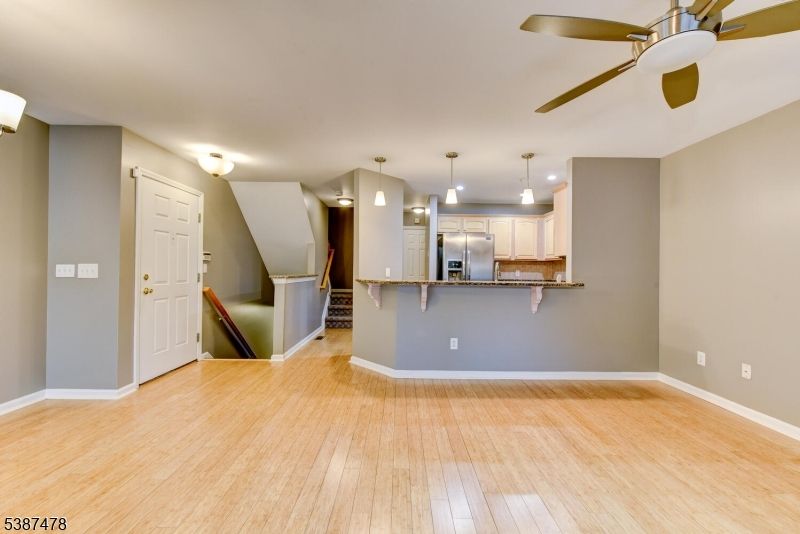 Empty room, Interior, Kitchen, Pendant Lights, Stainless Steel Appliances, Wood Texture Flooring