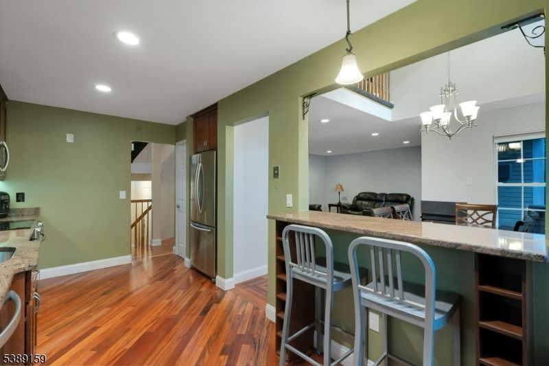 Chandelier, Interior, Kitchen, Pendant Lights, Recessed Lighting, Stainless Steel Appliances, Wood Texture Flooring