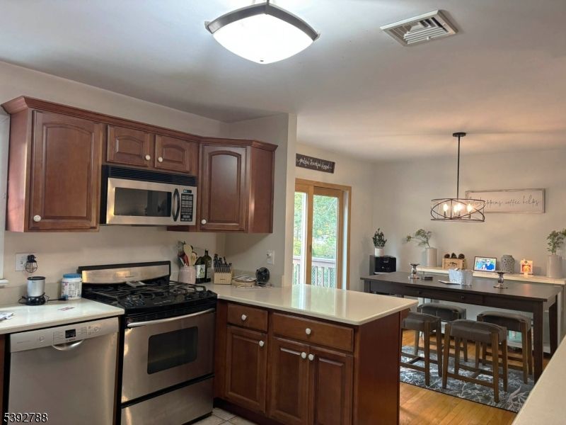 Dining room, Interior, Kitchen, Pendant Lights, Stainless Steel Appliances, Wood Texture Flooring