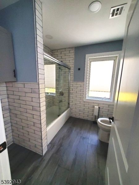 Bathroom, Glass Shower, Interior, Recessed Lighting, Stone Walls, Wood Texture Flooring