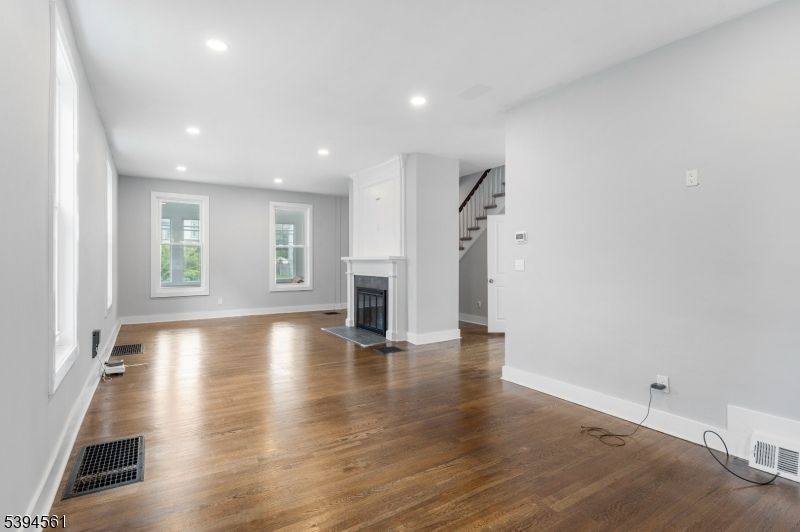 Empty room, Fireplace, Interior, Recessed Lighting, Wood Texture Flooring