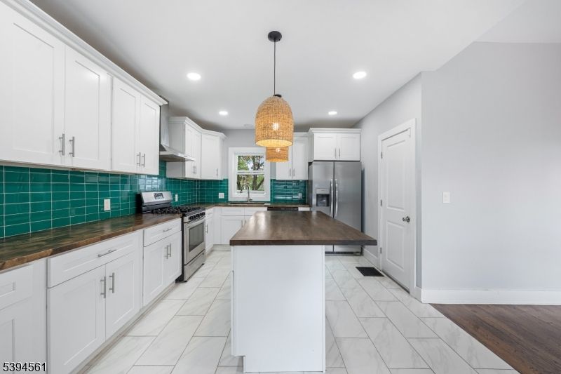 Interior, Kitchen, Marble, Pendant Lights, Recessed Lighting, Stainless Steel Appliances, Wood Texture Flooring