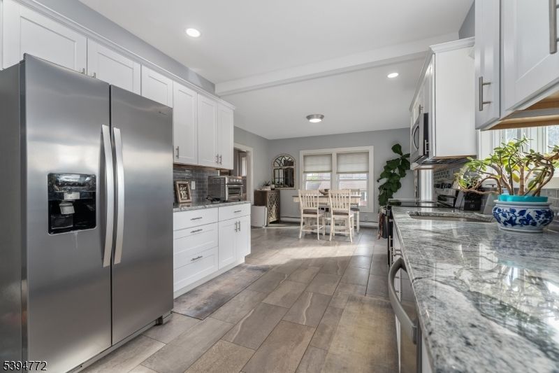 Dining room, Interior, Kitchen, Recessed Lighting, Stainless Steel Appliances, Wood Texture Flooring