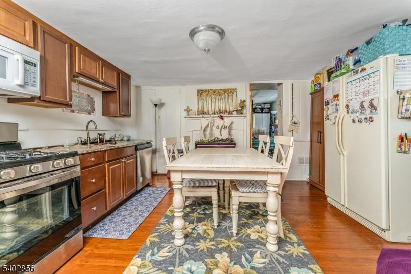 Dining room, Interior, Kitchen, Stainless Steel Appliances, Tile Countertops, Wood Texture Flooring