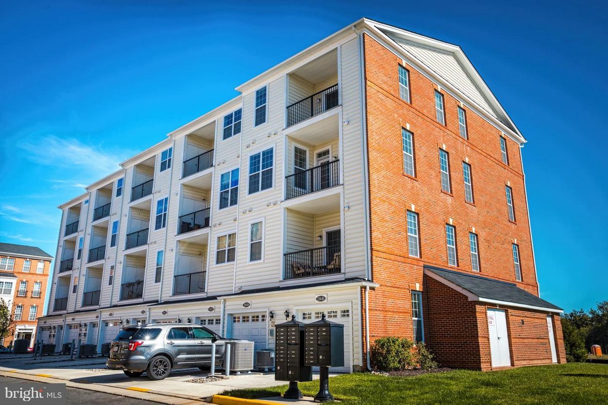 Attached, Exterior, Facade, Brick Facade, Condo Building