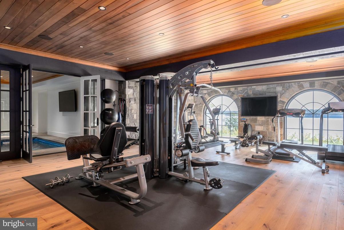 Fireplace, Fitness Equipment, Interior, Recessed Lighting, Stone Walls, Wooden Ceilings, Wood Texture Flooring