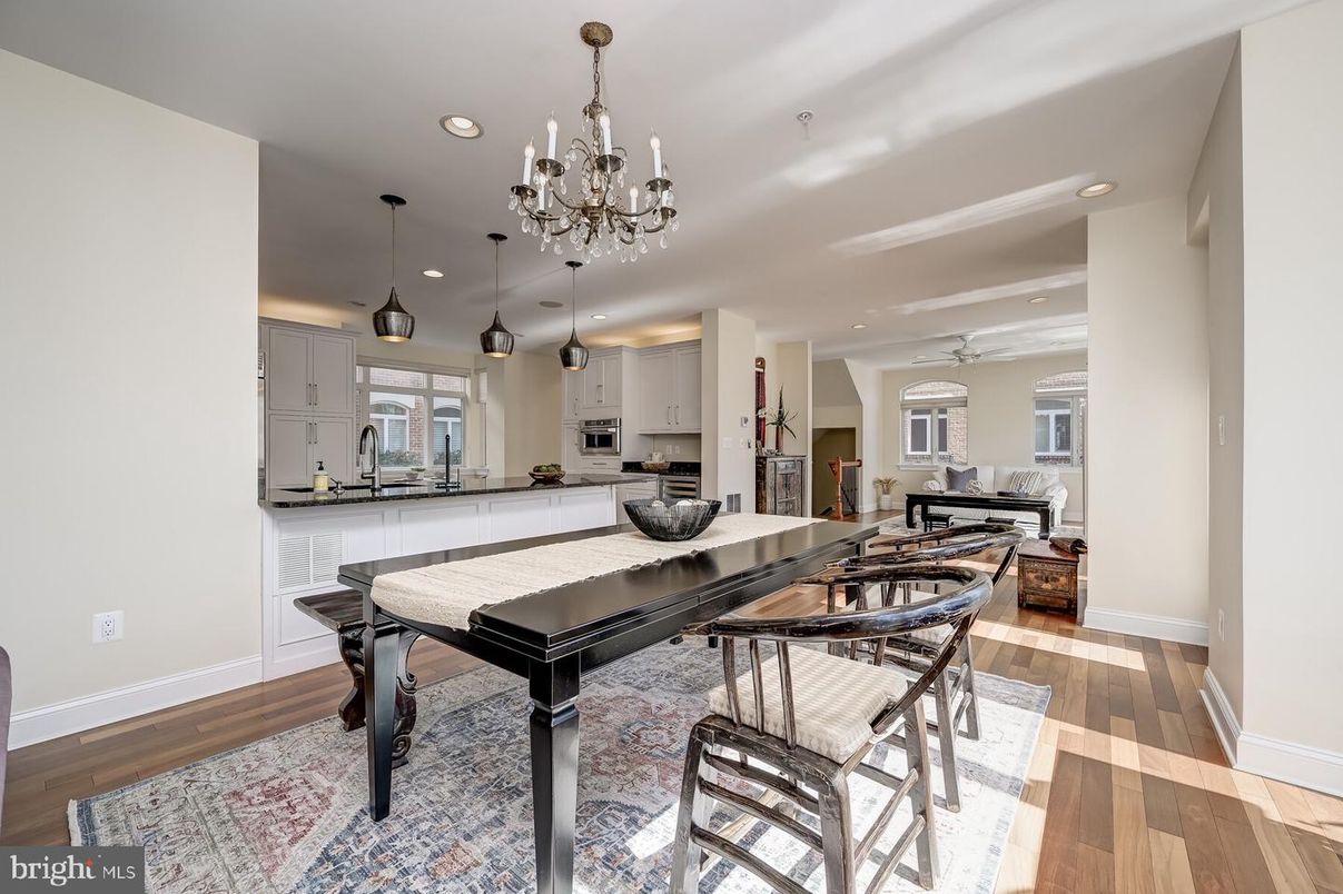 Chandelier, Dining room, Interior, Kitchen, Living room, Pendant Lights, Recessed Lighting, Stainless Steel Appliances, Wood Texture Flooring