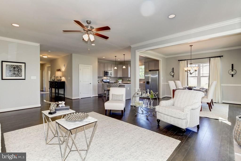 Chandelier, Dining room, Interior, Kitchen, Living room, Pendant Lights, Recessed Lighting, Stainless Steel Appliances, Wood Texture Flooring