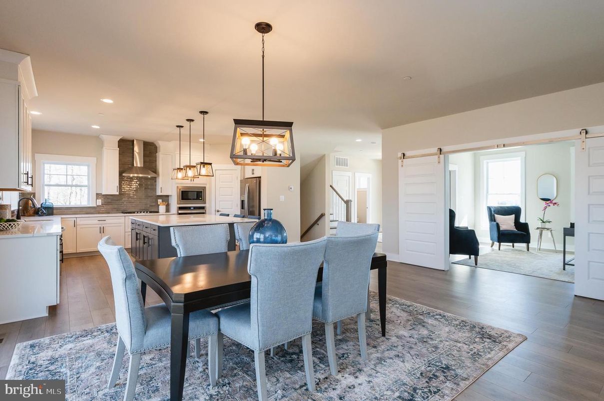 Dining room, Interior, Kitchen, Pendant Lights, Recessed Lighting, Stainless Steel Appliances, Wood Texture Flooring
