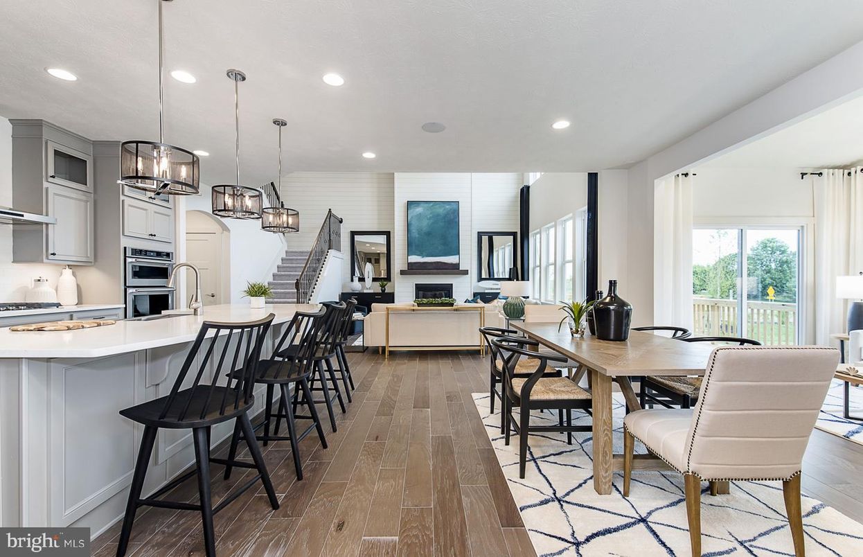 Dining room, Fireplace, Interior, Kitchen, Living room, Pendant Lights, Recessed Lighting, Stainless Steel Appliances, Wood Texture Flooring