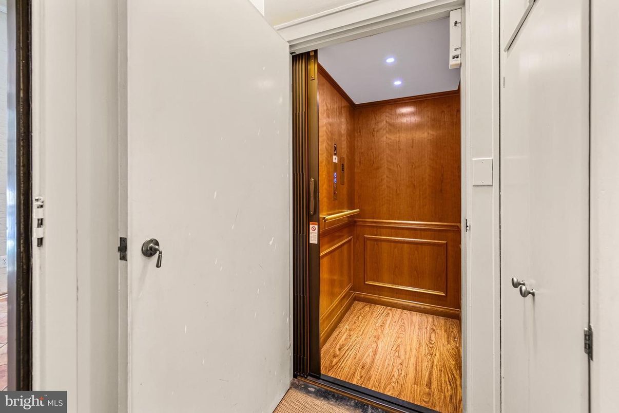 Elevator, Interior, Recessed Lighting, Wood Texture Flooring, Wooden Walls