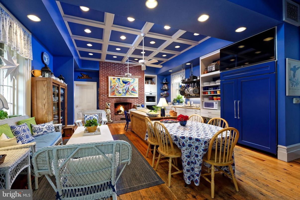 Dining room, Fireplace, Interior, Living room, Recessed Lighting, Stone Walls, Wood Texture Flooring