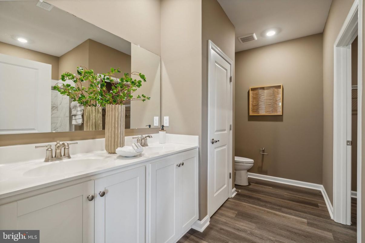 Bathroom, Dual Sink Vanities, Interior, Recessed Lighting, Wood Texture Flooring