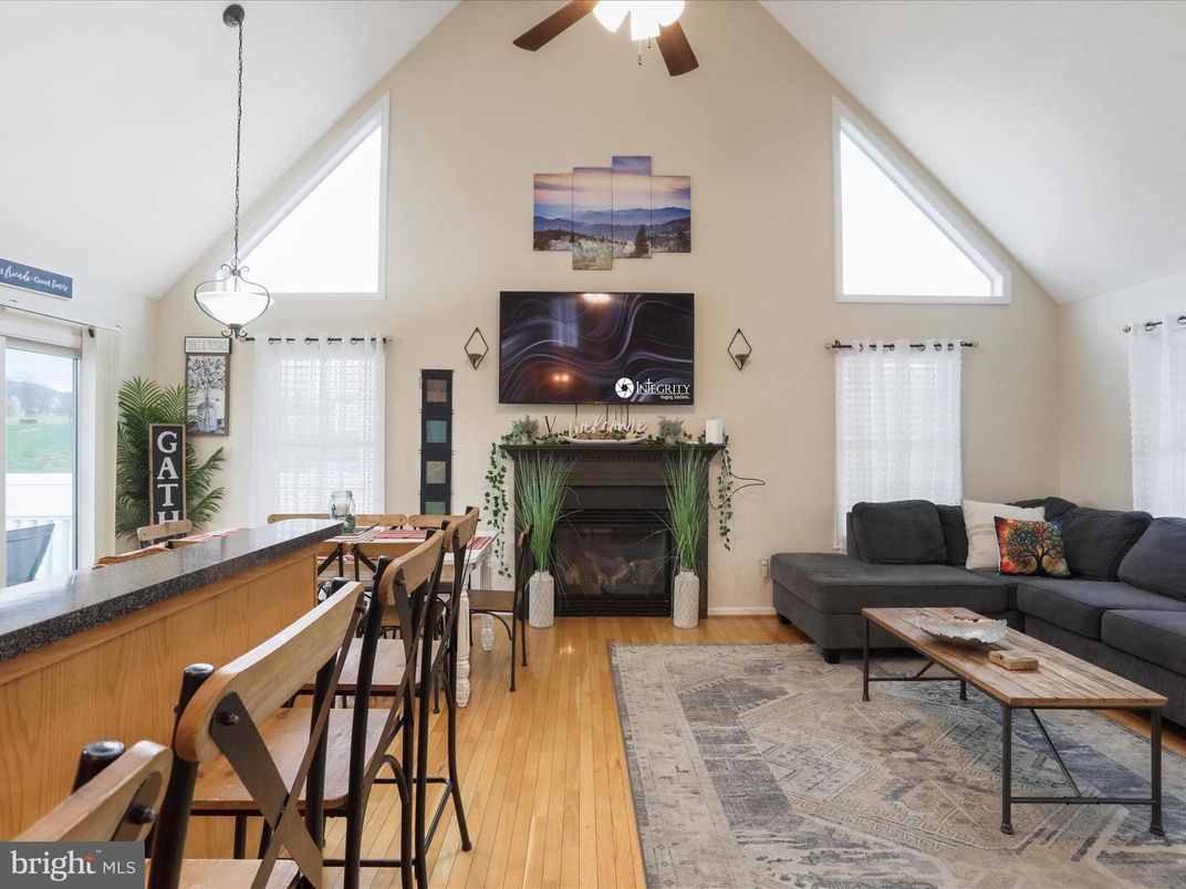 Dining room, Fireplace, Interior, Living room, Pendant Lights, Wood Texture Flooring