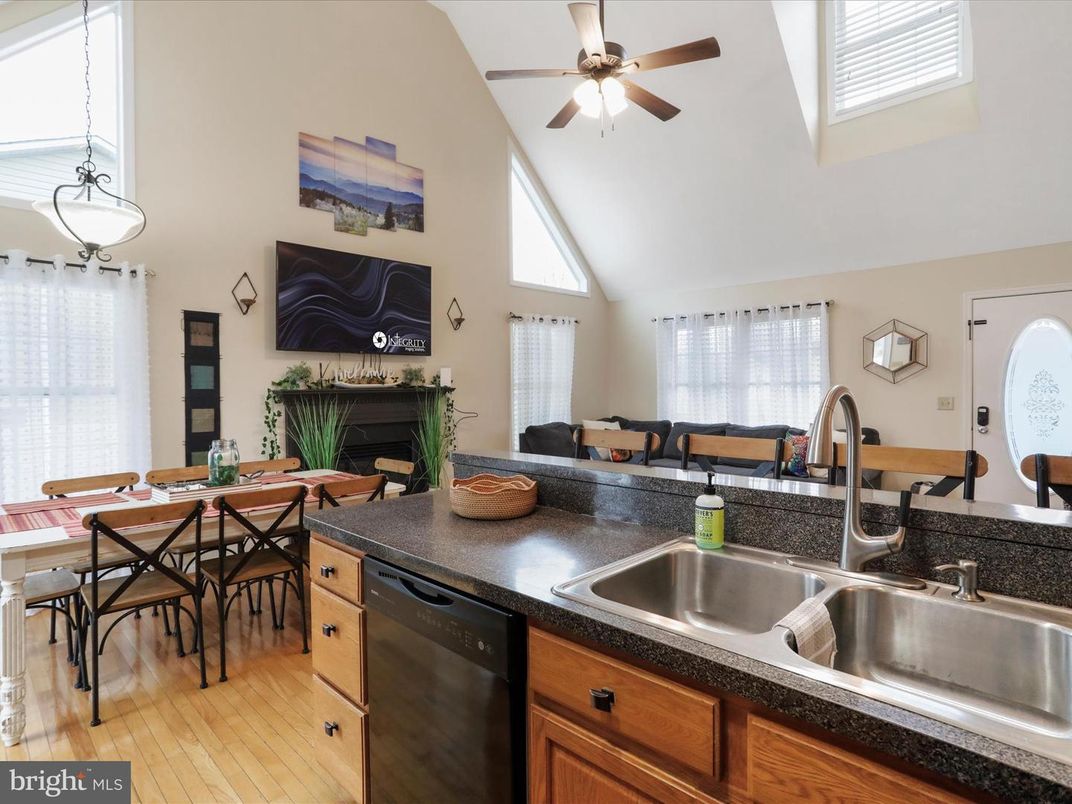Dining room, Fireplace, Interior, Kitchen, Pendant Lights, Wood Texture Flooring