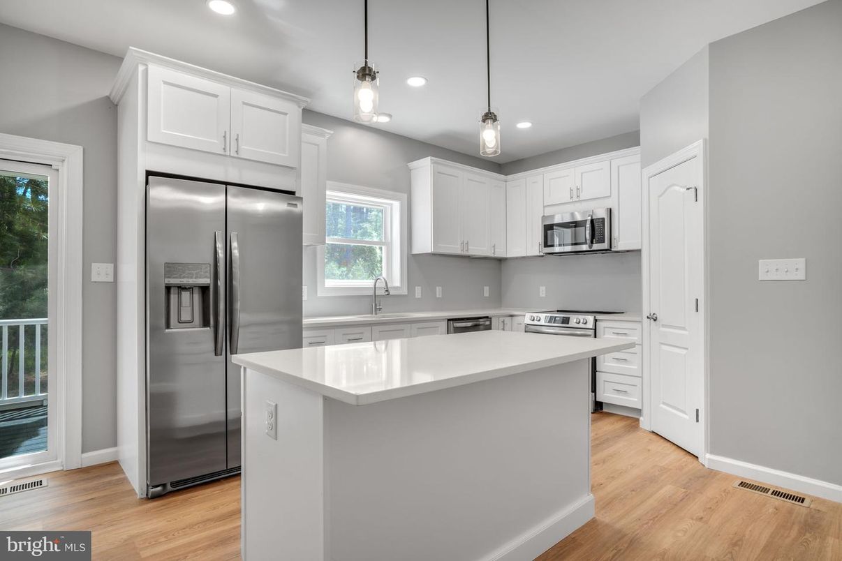 Interior, Kitchen, Pendant Lights, Recessed Lighting, Stainless Steel Appliances, Wood Texture Flooring