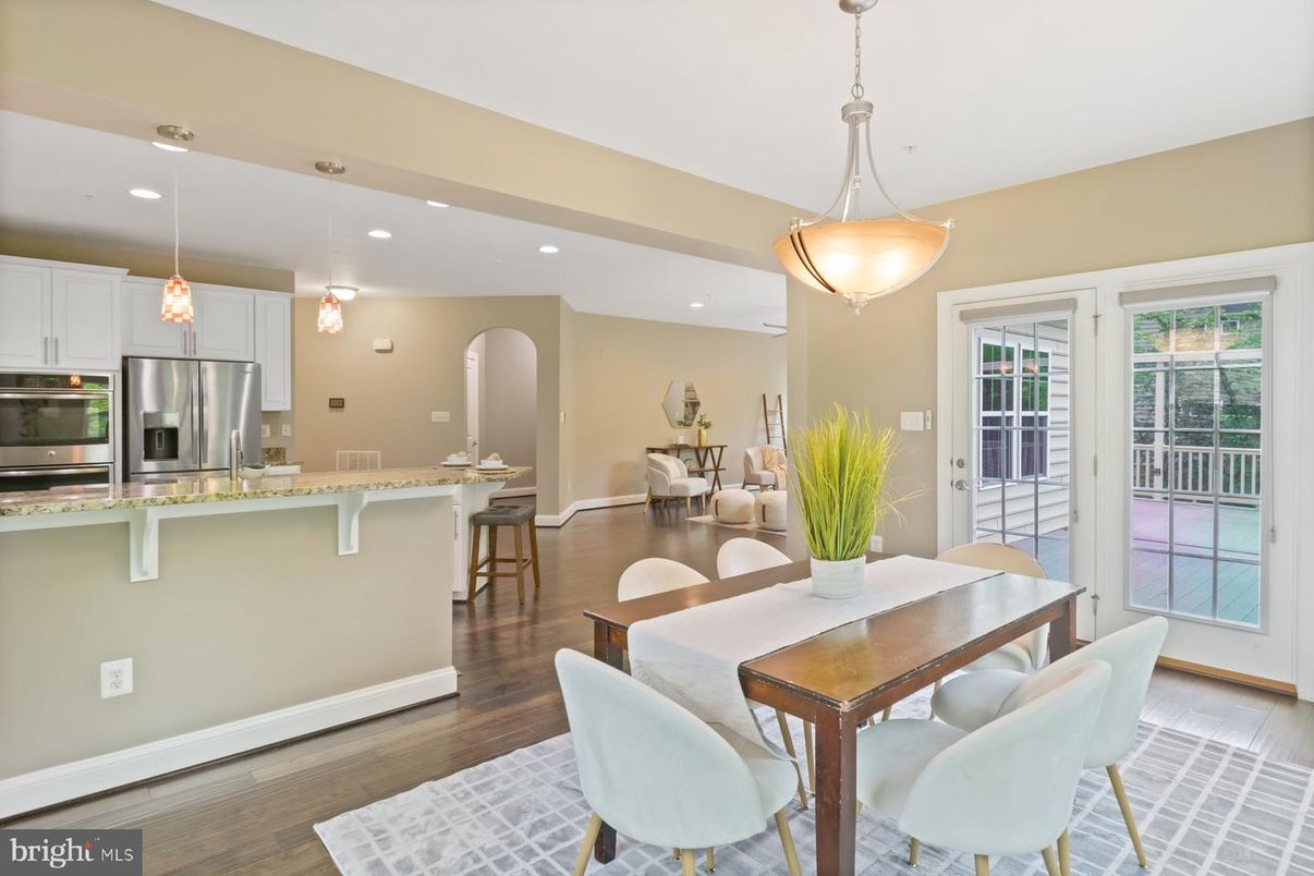 Dining room, Interior, Kitchen, Pendant Lights, Recessed Lighting, Stainless Steel Appliances, Wood Texture Flooring