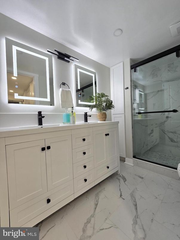 Bathroom, Dual Sink Vanities, Glass Shower, Interior, Marble, Marble Walls, Recessed Lighting