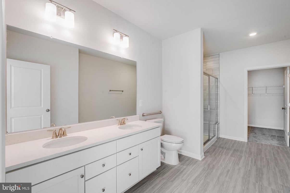Bathroom, Dual Sink Vanities, Glass Shower, Interior, Recessed Lighting, Walk-in Closets, Wood Texture Flooring