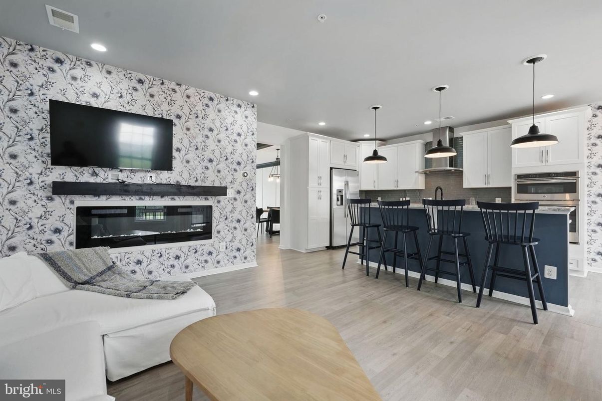 Fireplace, Interior, Kitchen, Living room, Pendant Lights, Recessed Lighting, Stainless Steel Appliances, Wood Texture Flooring