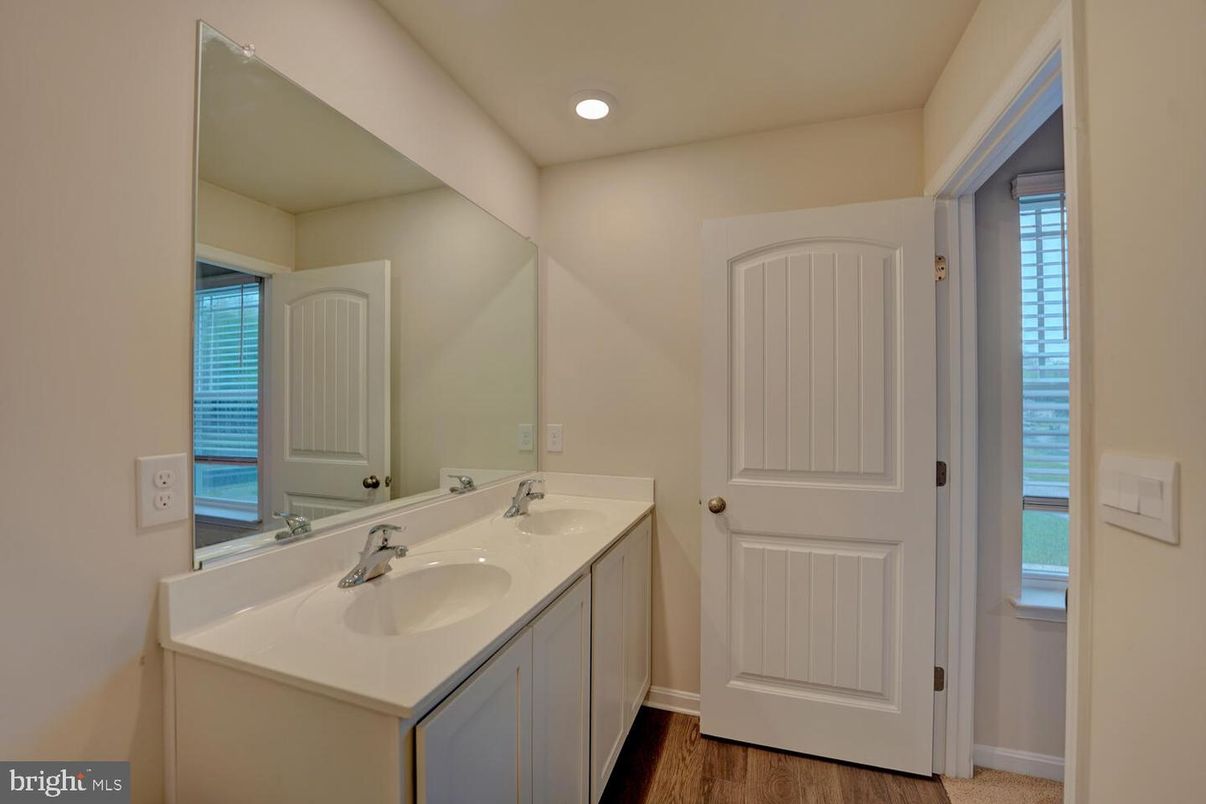 Bathroom, Dual Sink Vanities, Interior, Recessed Lighting, Wood Texture Flooring