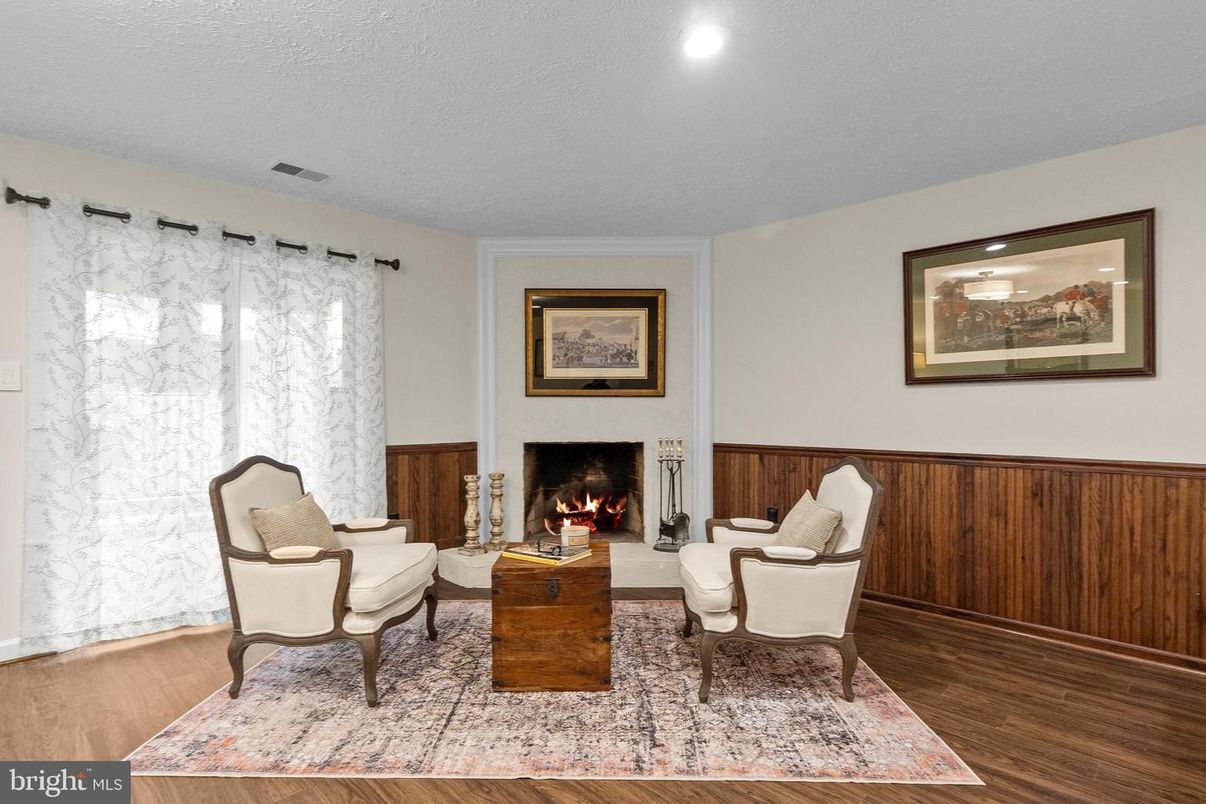 Fireplace, Interior, Living room, Marble Walls, Recessed Lighting, Wood Texture Flooring