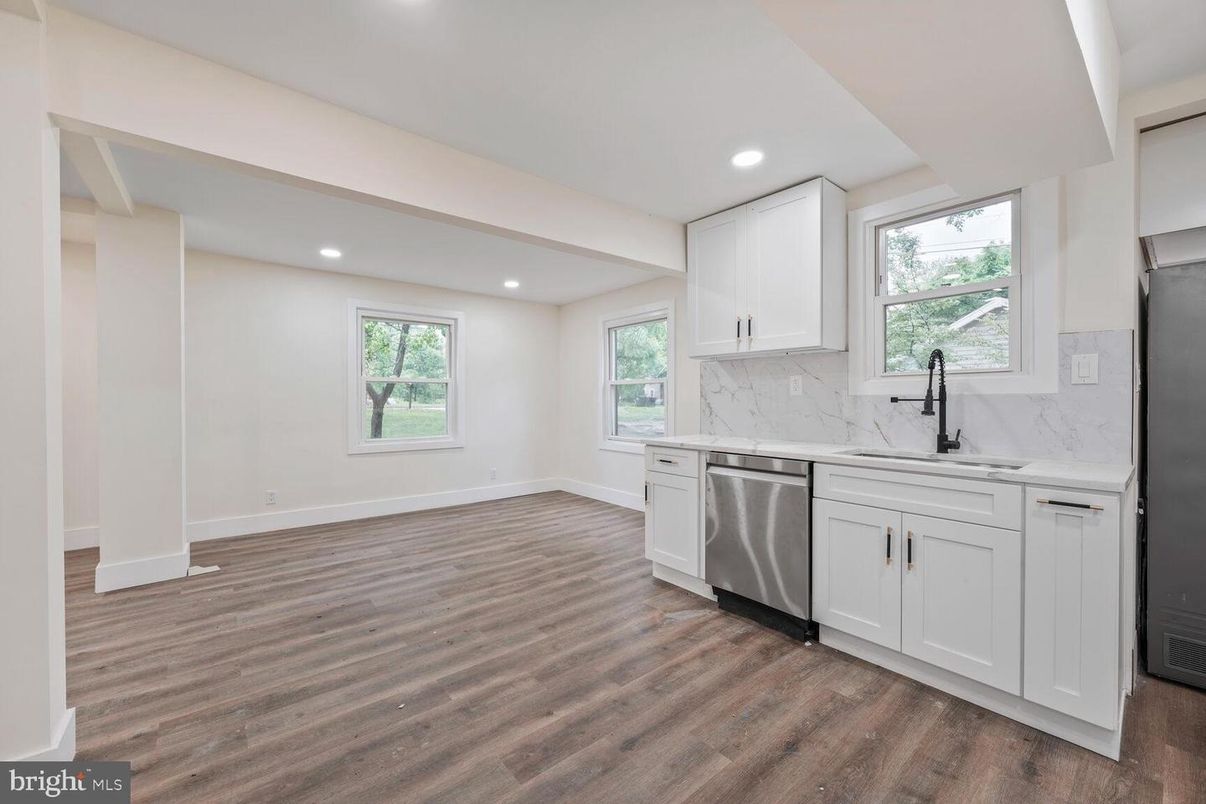 Interior, Kitchen, Marble Walls, Recessed Lighting, Stainless Steel Appliances, Wood Texture Flooring