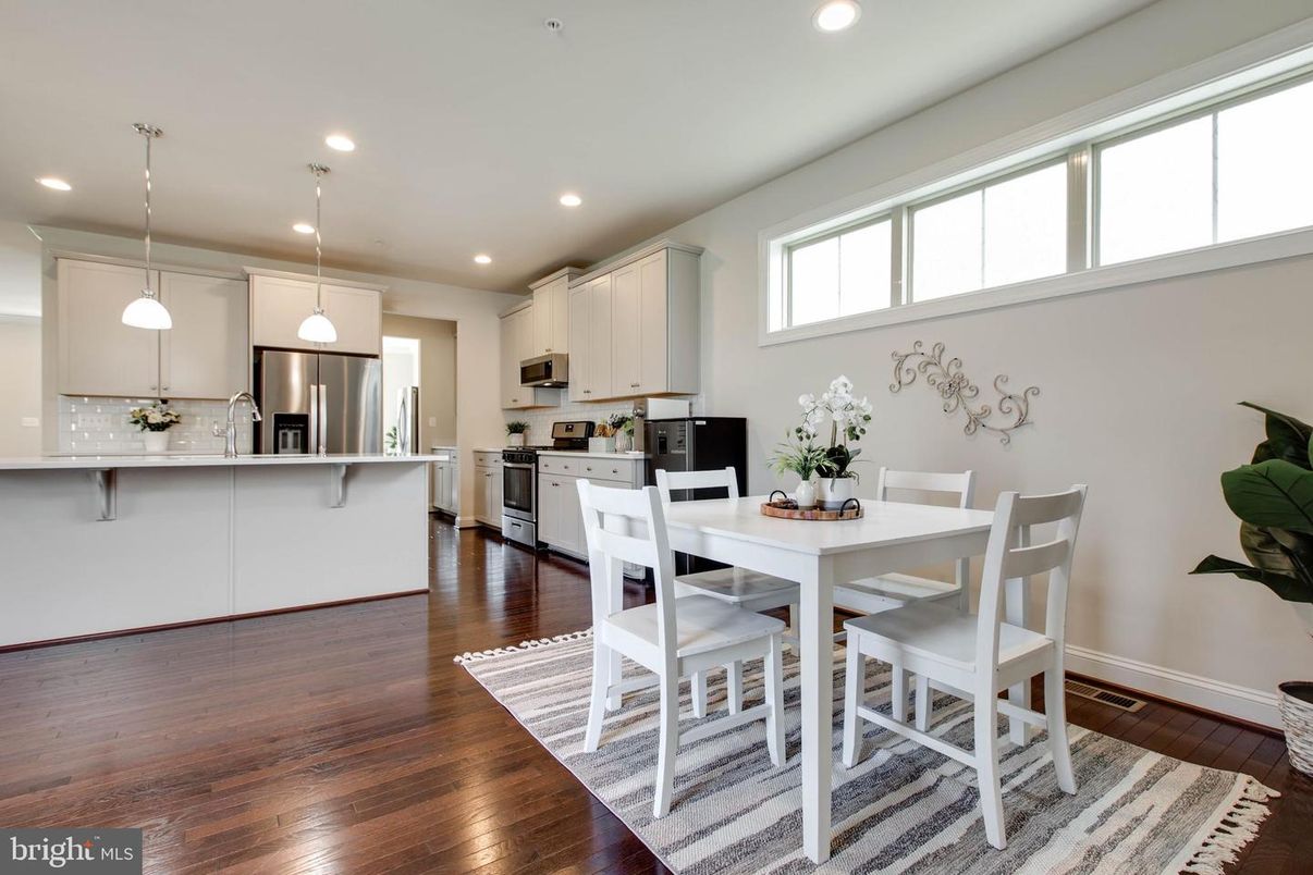Dining room, Interior, Kitchen, Pendant Lights, Recessed Lighting, Stainless Steel Appliances, Wood Texture Flooring