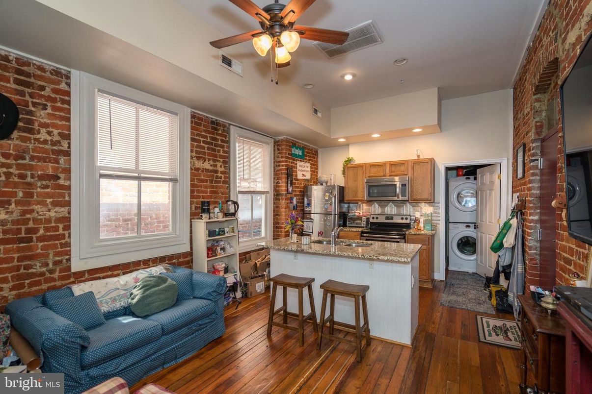 Interior, Kitchen, Recessed Lighting, Stainless Steel Appliances, Stone Walls, Washer, Wood Texture Flooring