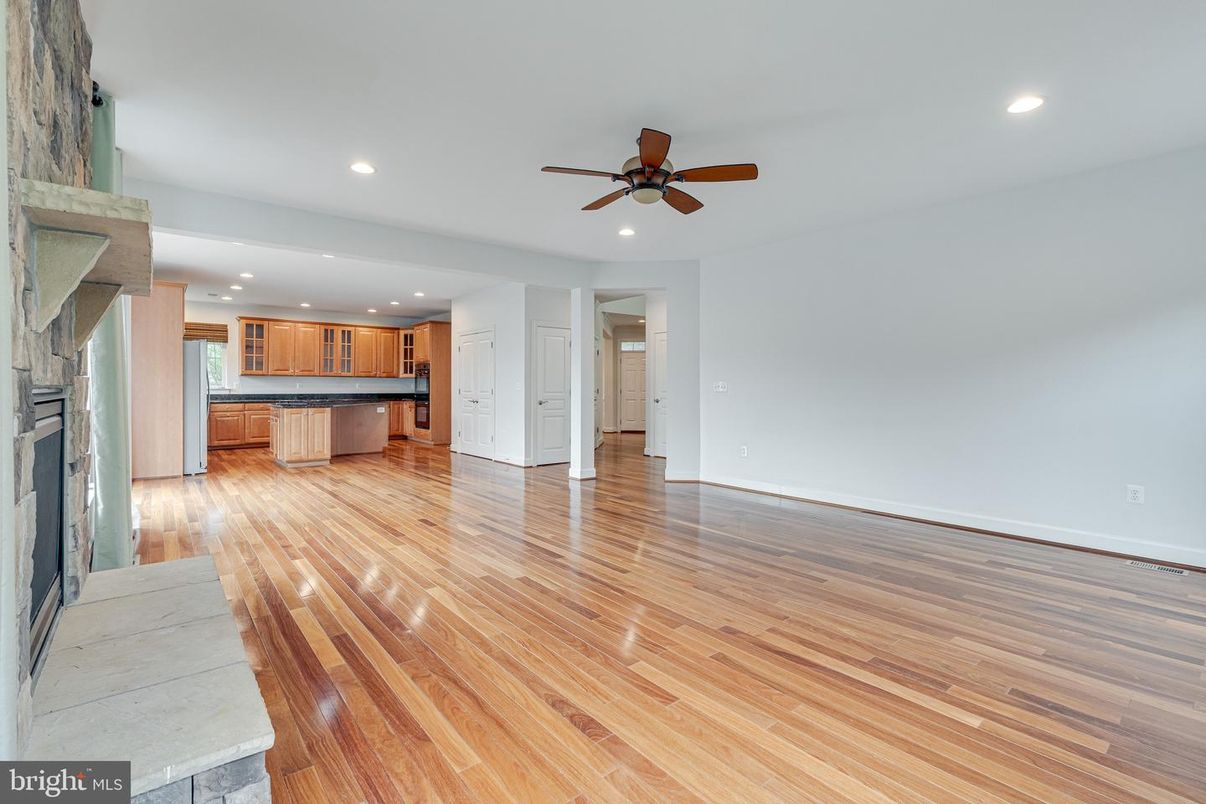 Empty room, Fireplace, Interior, Kitchen, Recessed Lighting, Wood Texture Flooring