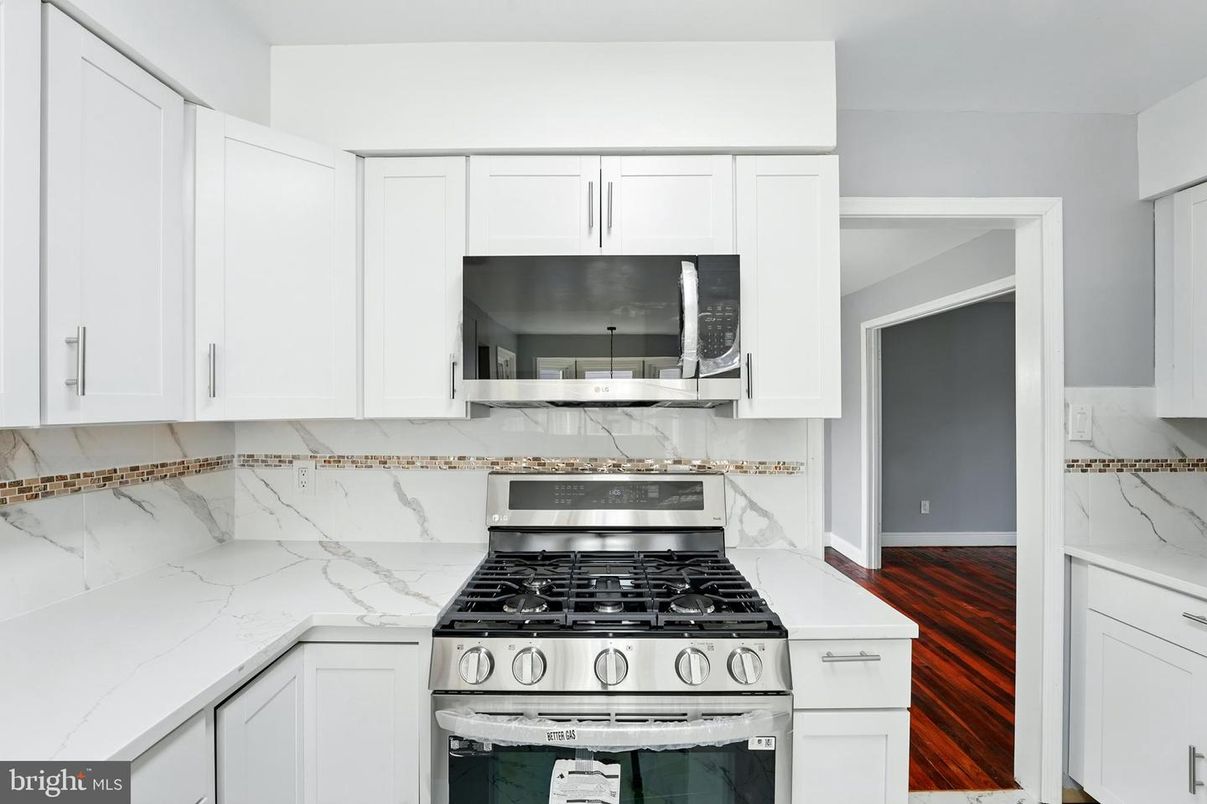 Interior, Kitchen, Marble Walls, Stainless Steel Appliances, Wood Texture Flooring