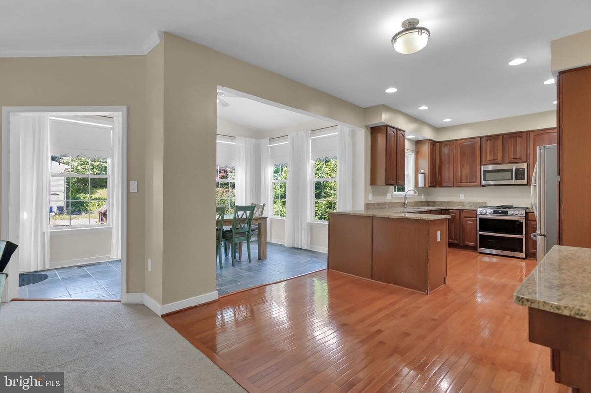 Dining room, Interior, Kitchen, Recessed Lighting, Stainless Steel Appliances, Wood Texture Flooring