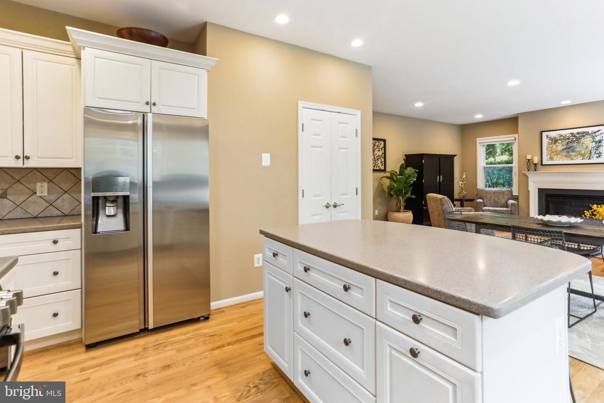 Fireplace, Interior, Kitchen, Recessed Lighting, Stainless Steel Appliances, Wood Texture Flooring