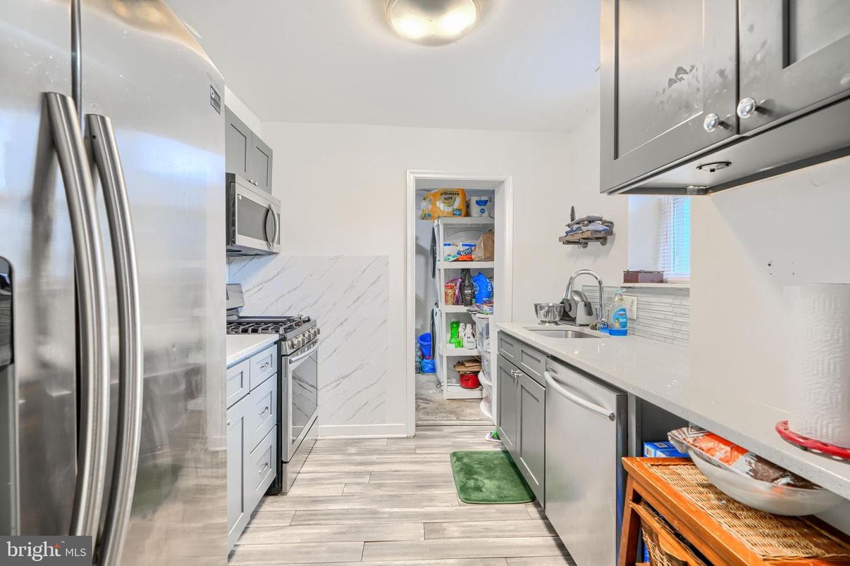 Interior, Kitchen, Marble Walls, Stainless Steel Appliances, Wood Texture Flooring