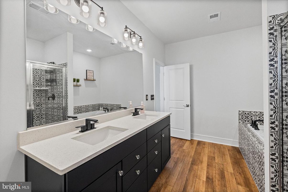 Bathroom, Dual Sink Vanities, Glass Shower, Interior, Recessed Lighting, Wood Texture Flooring
