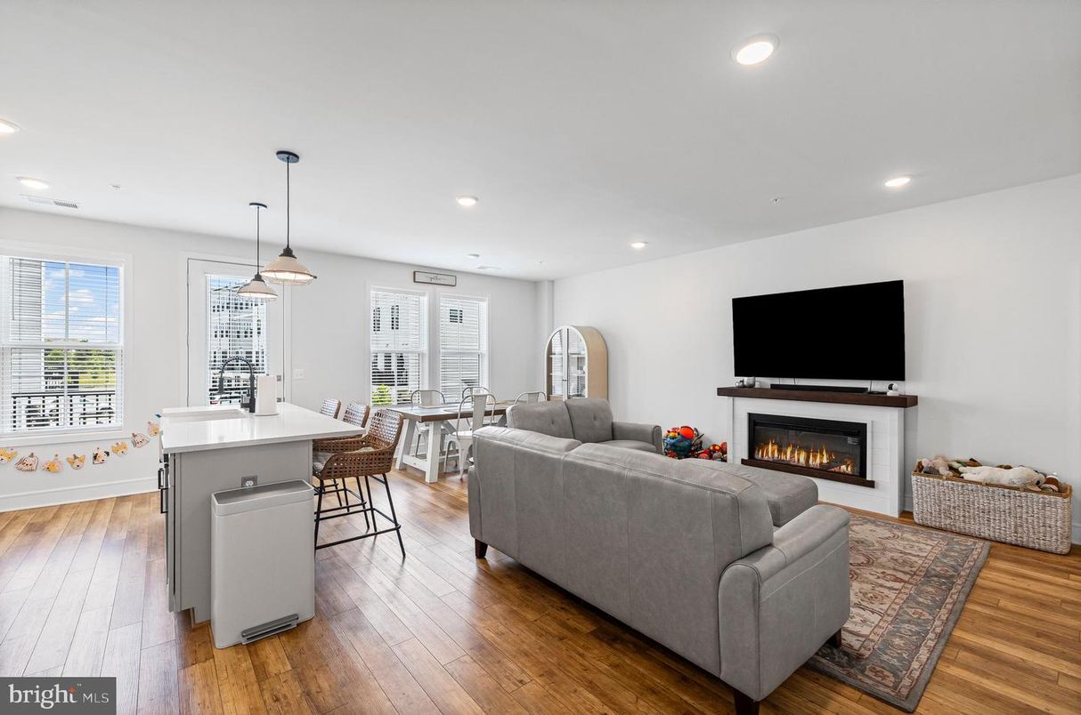Dining room, Fireplace, Interior, Living room, Pendant Lights, Recessed Lighting, Wood Texture Flooring
