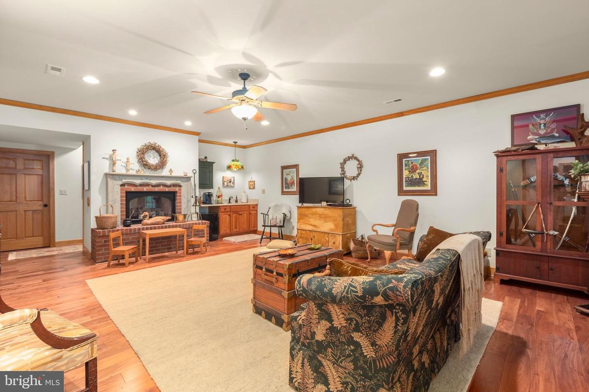 Dining room, Fireplace, Interior, Living room, Recessed Lighting, Wood Texture Flooring
