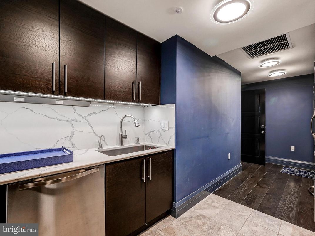 Interior, Kitchen, Marble Walls, Recessed Lighting, Stainless Steel Appliances, Wood Texture Flooring