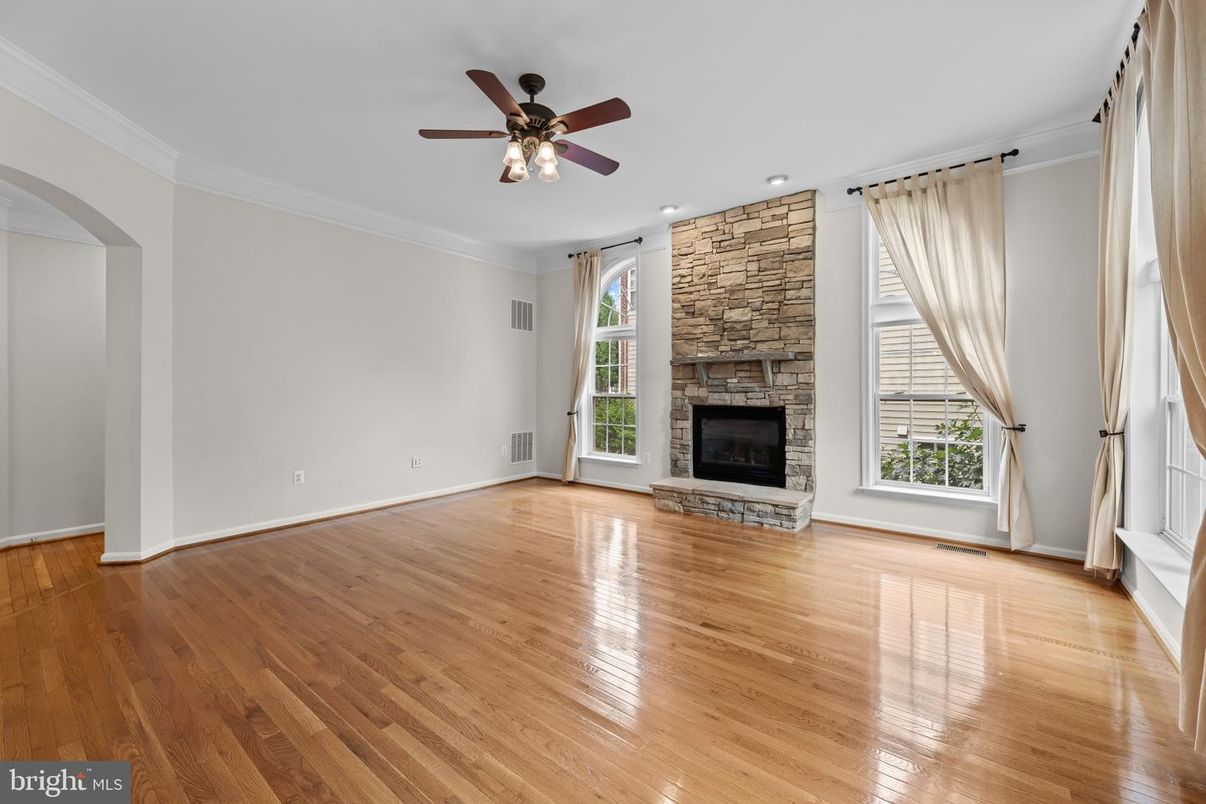 Empty room, Fireplace, Interior, Recessed Lighting, Stone Walls, Wood Texture Flooring