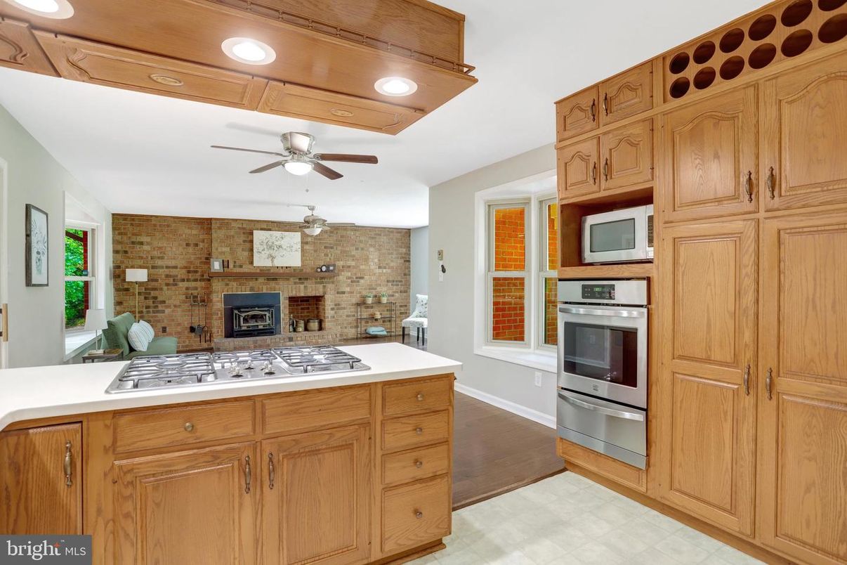 Interior, Kitchen, Recessed Lighting, Stainless Steel Appliances, Stone Walls, Wood Texture Flooring