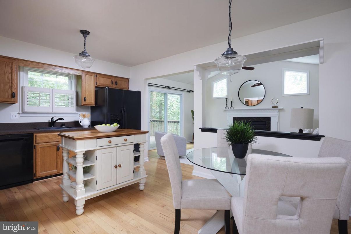 Dining room, Fireplace, Interior, Kitchen, Pendant Lights, Wood Texture Flooring